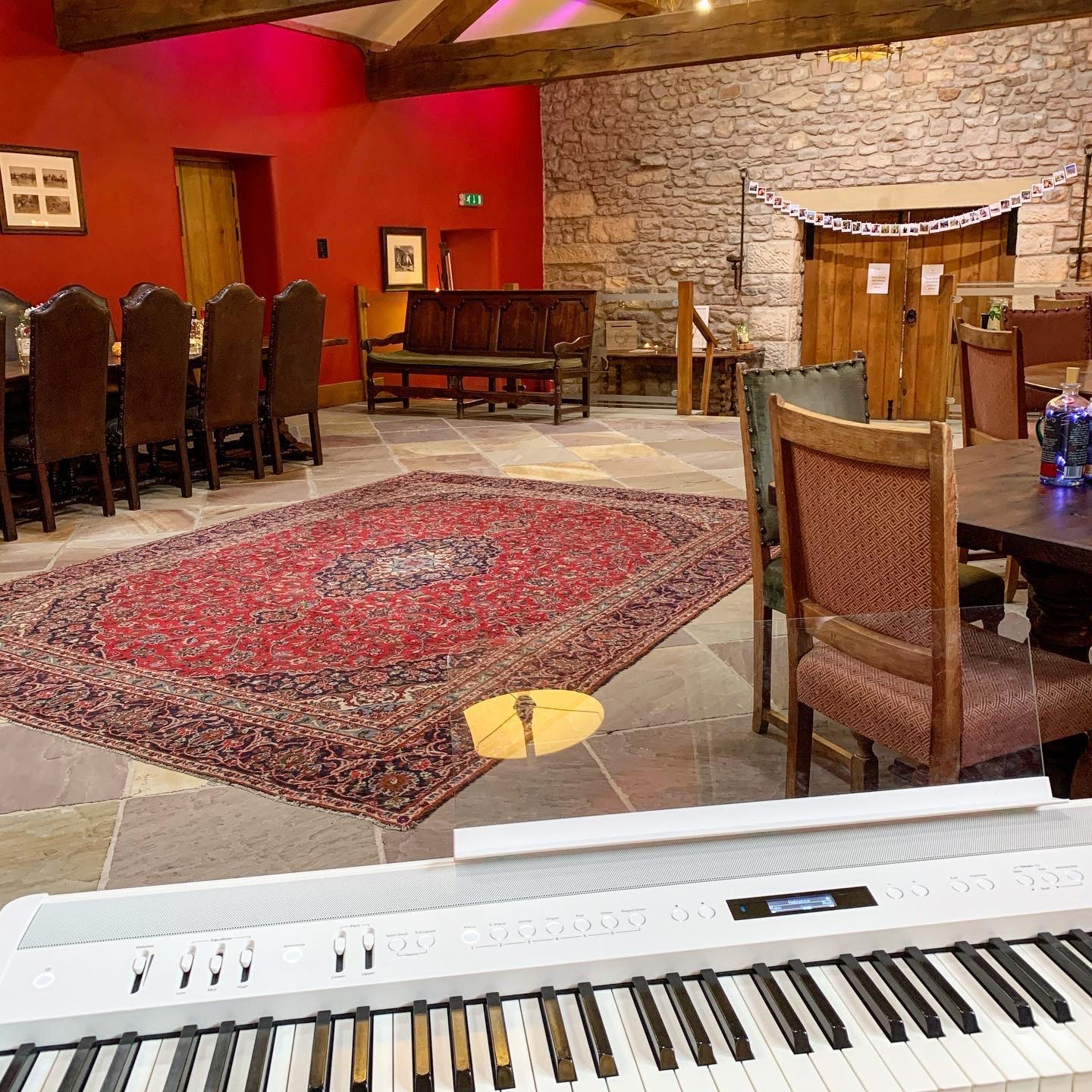 Piano at a Browsholme Hall Tithe Barn drinks reception