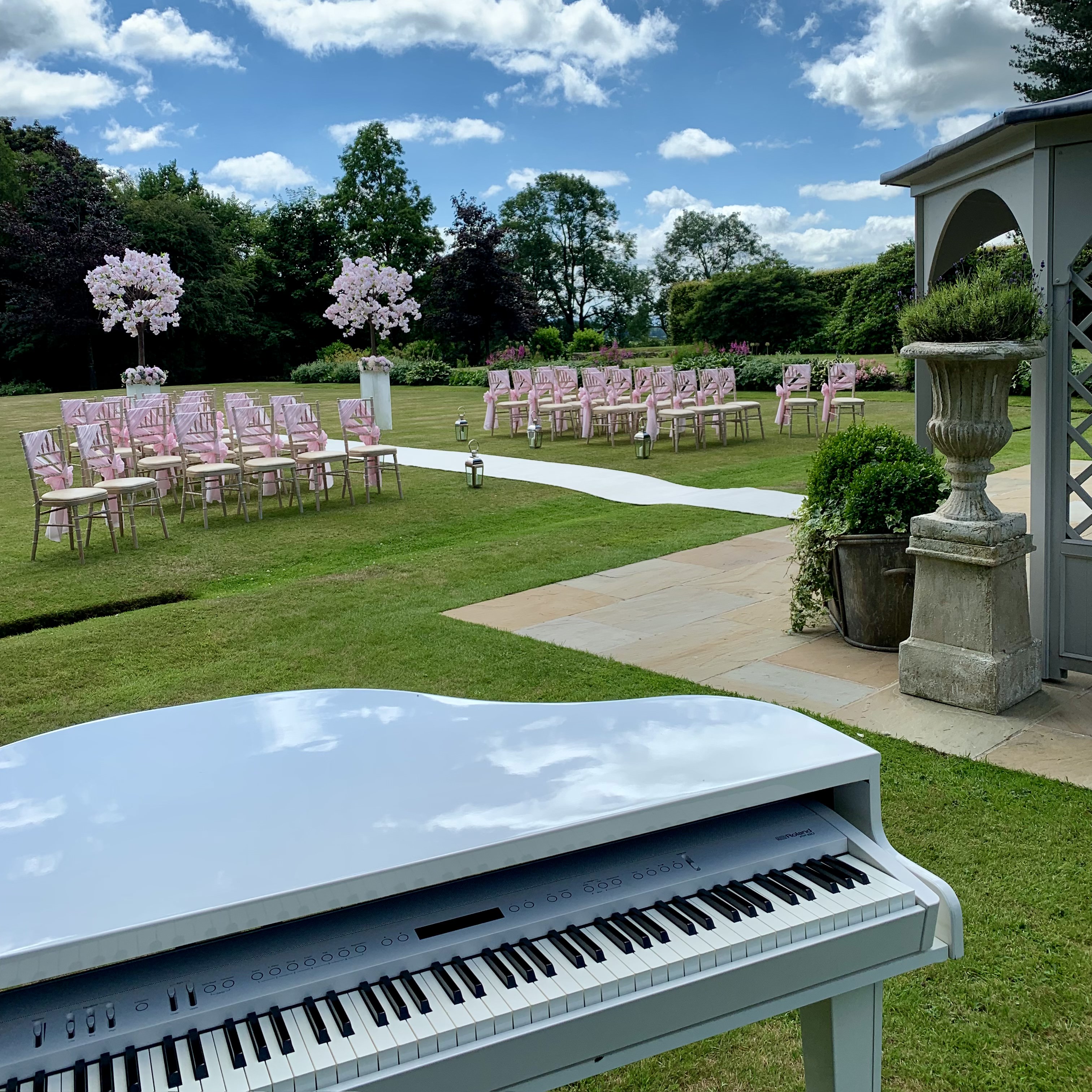 Craig Smith Wedding Pianist playing Piano for Eaves Hall Wedding Ceremony on the Bowling Green