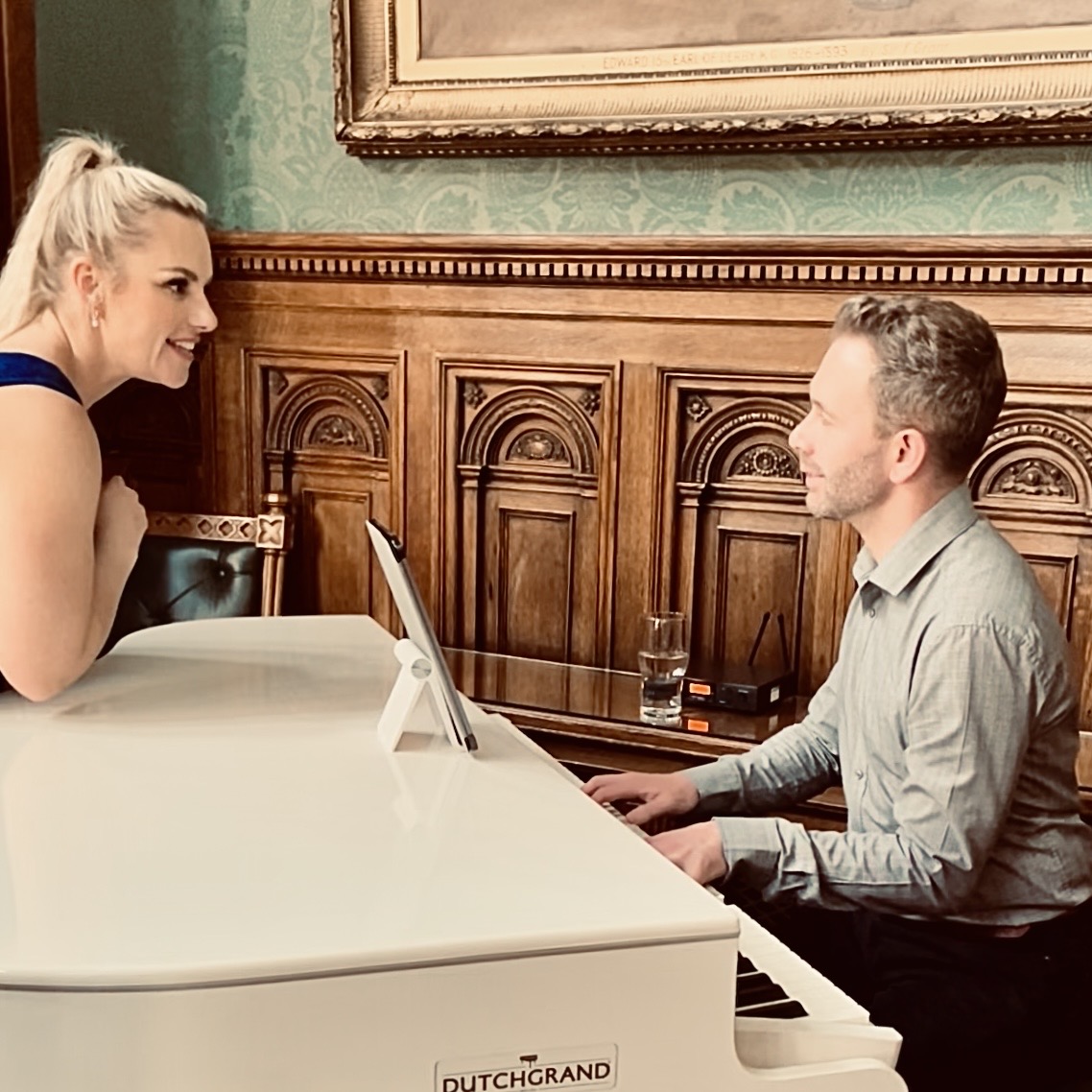 Knowsley Hall wedding pianist Craig Smith takes a request from a guest whilst playing during a wedding breakfast