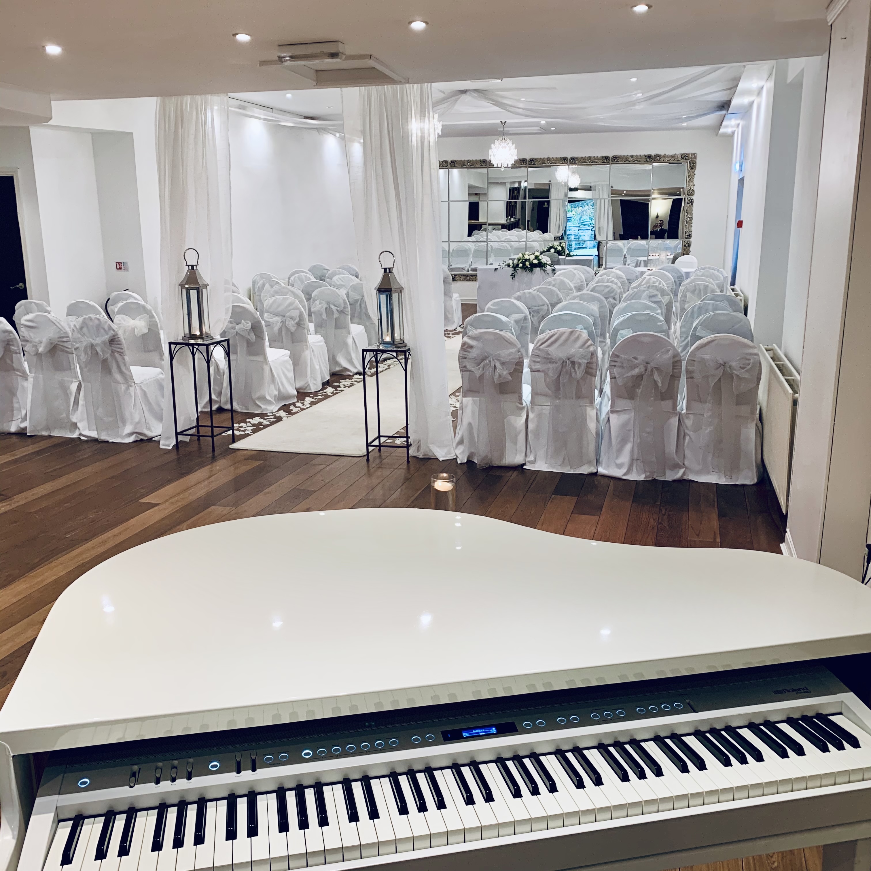 Sparth House wedding pianist Craig Smith's white piano set up ready for wedding ceremony