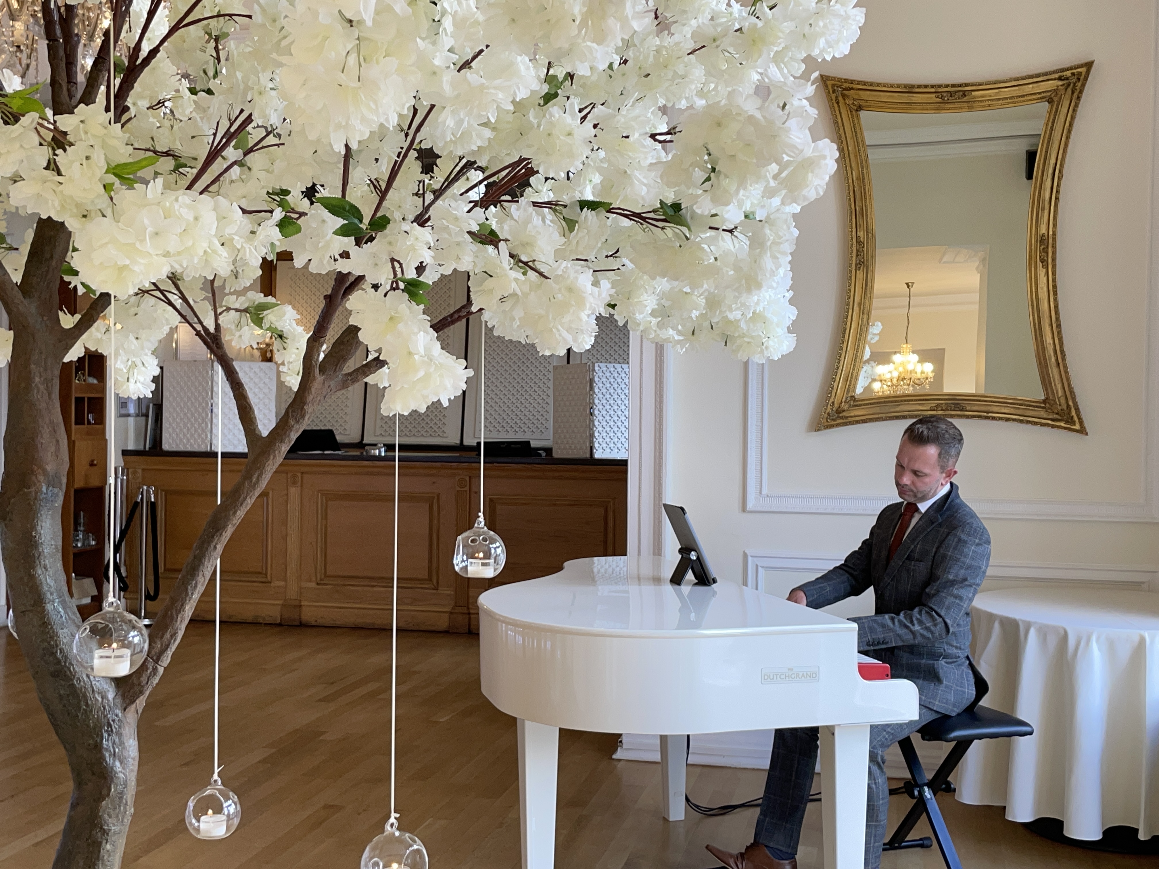 West Tower wedding pianist Craig Smith plays his white piano during a wedding ceremony